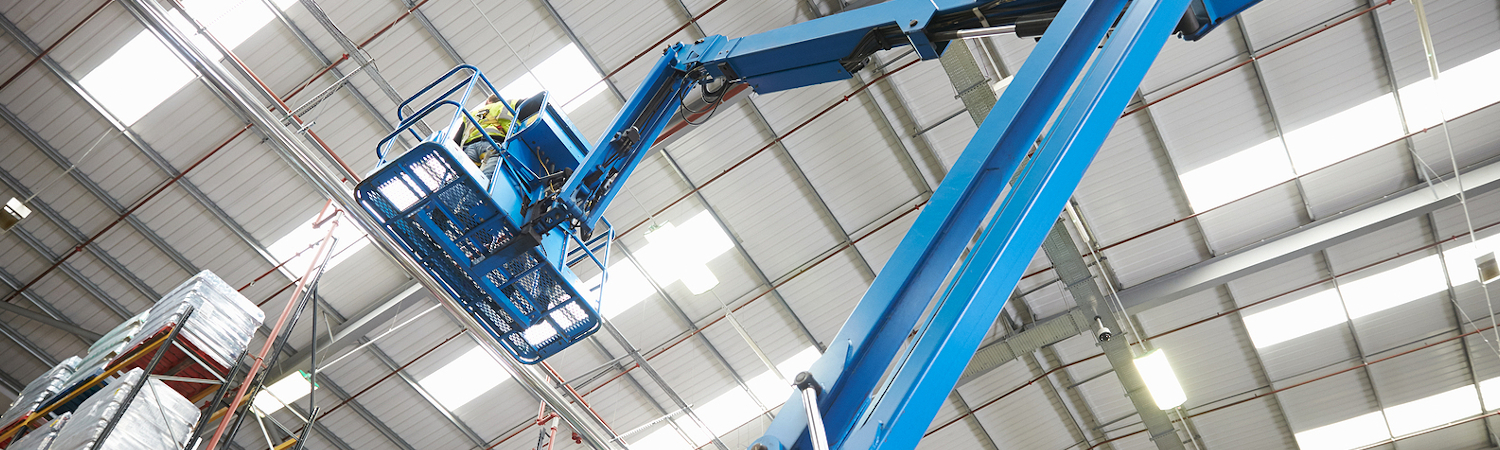 Blue crane inside warehouse