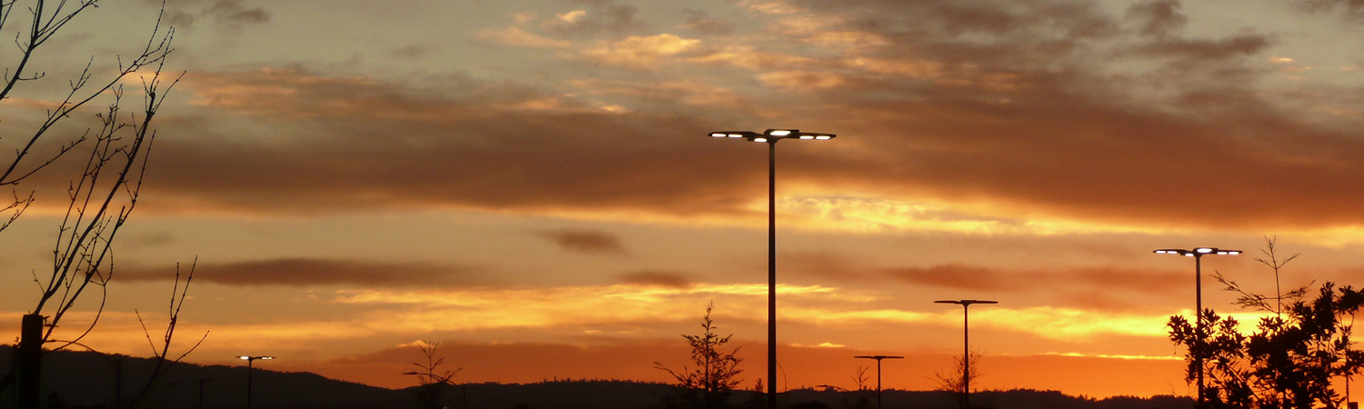 Parking lot lighting with sunset